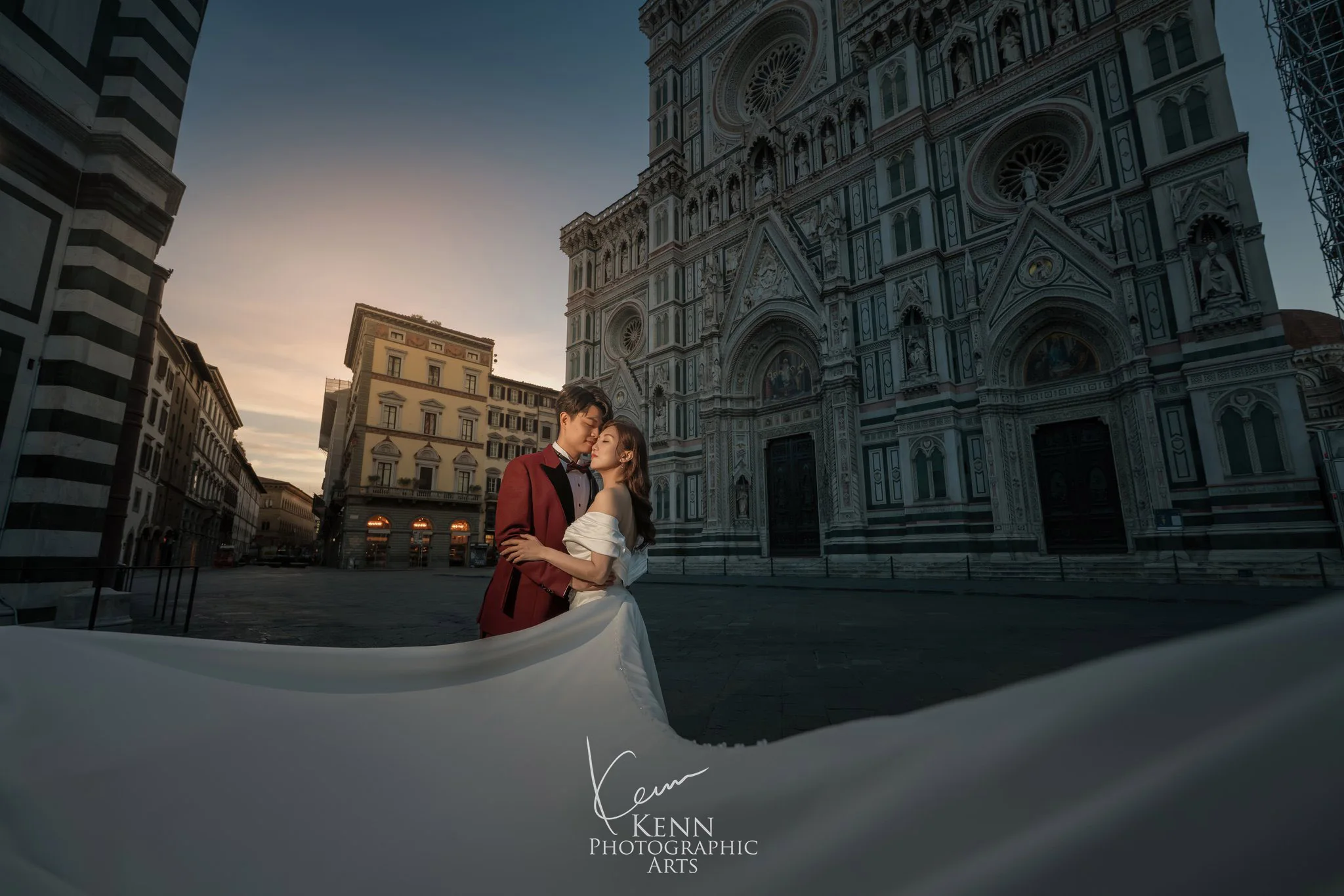 Wincy & Leo in Piazza del Duomo at dawn, her long veil sweeping across the square, Florence — Florence & Tuscany pre-wedding by Kenn Photographic Arts
