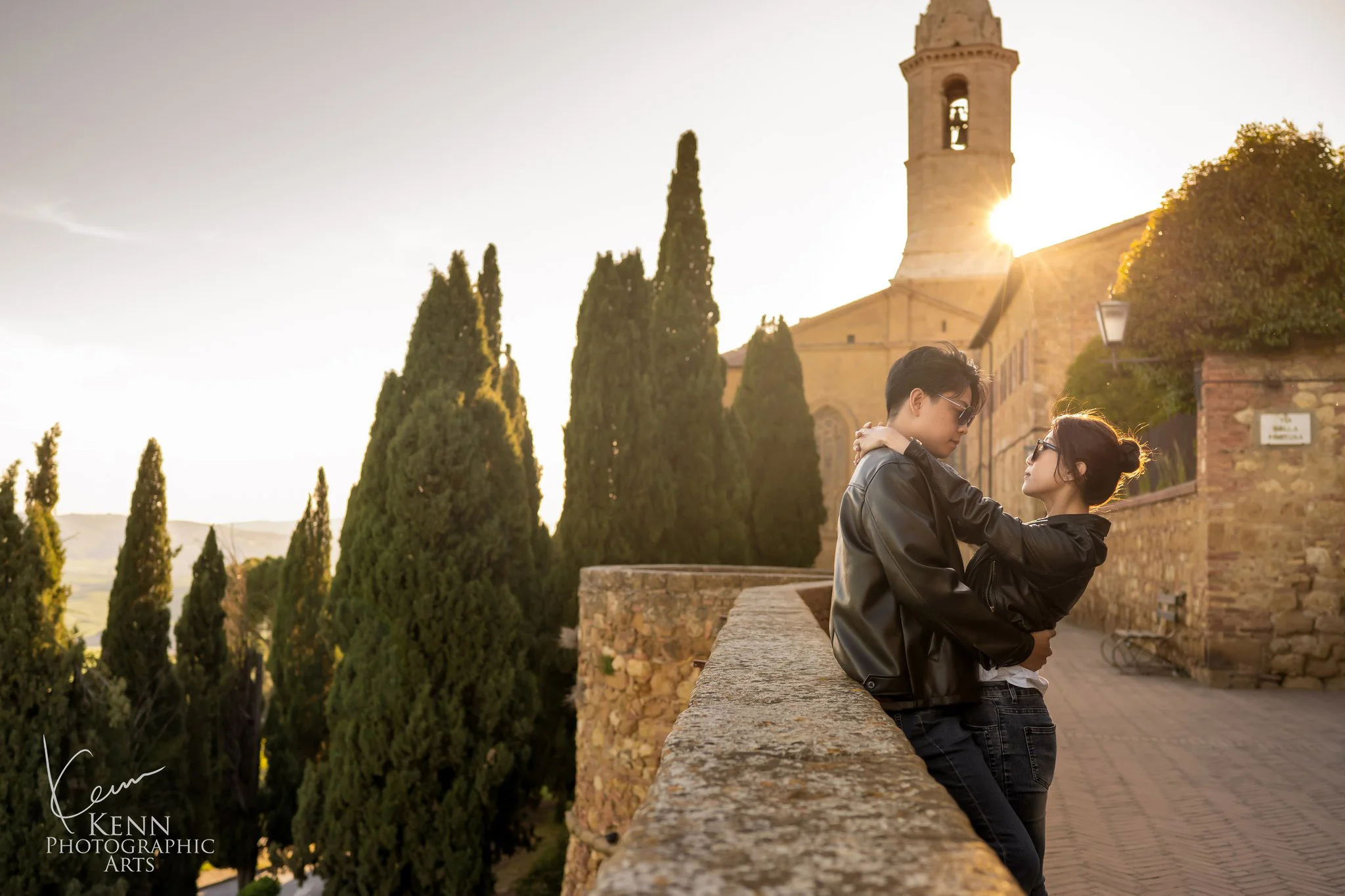 Wincy & Leo on the old town walls of Pienza at sunset, Tuscany — Florence & Tuscany pre-wedding by Kenn Photographic Arts