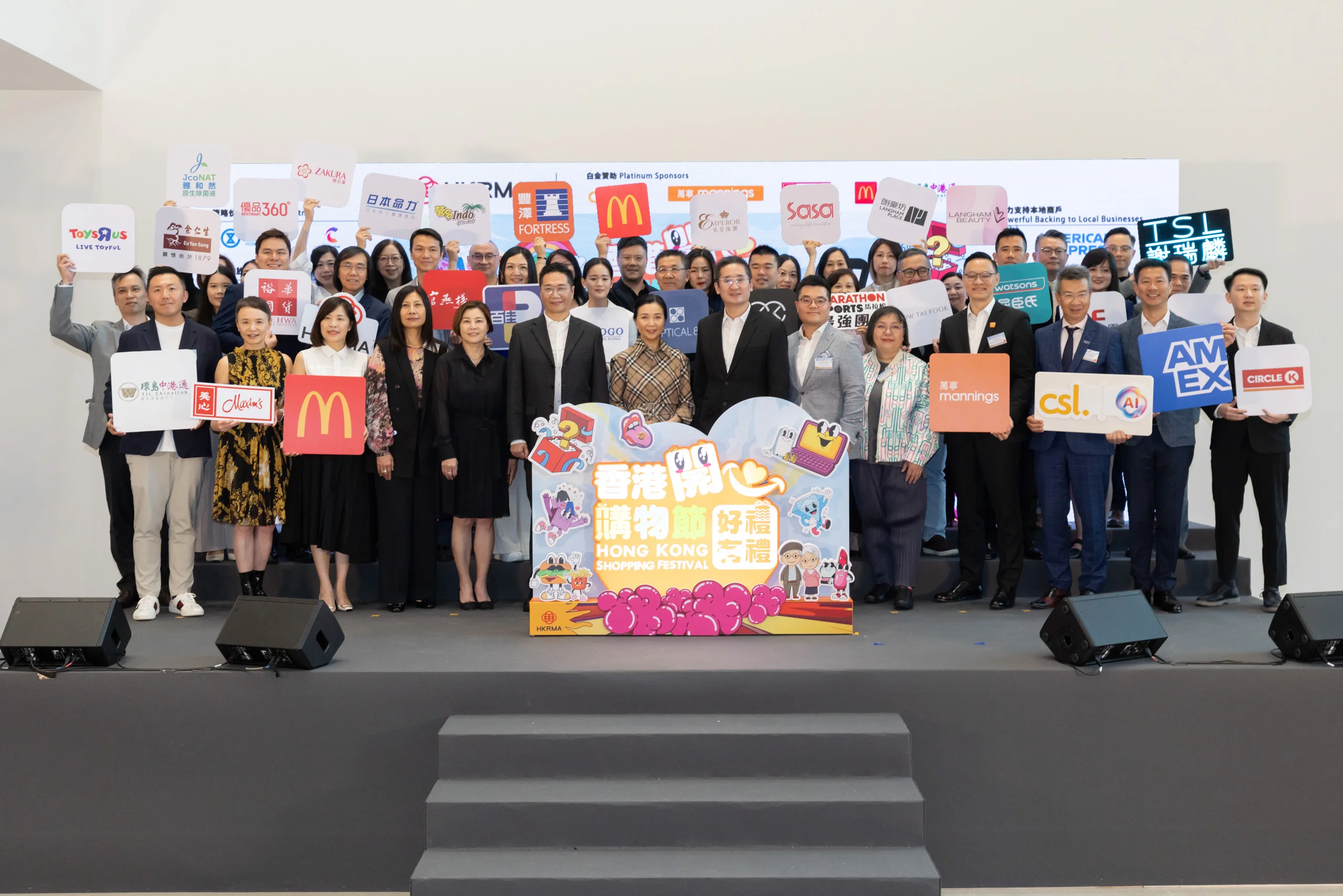 Corporate group photo on stage at a launch event — event photography by Kenn Photographic Arts