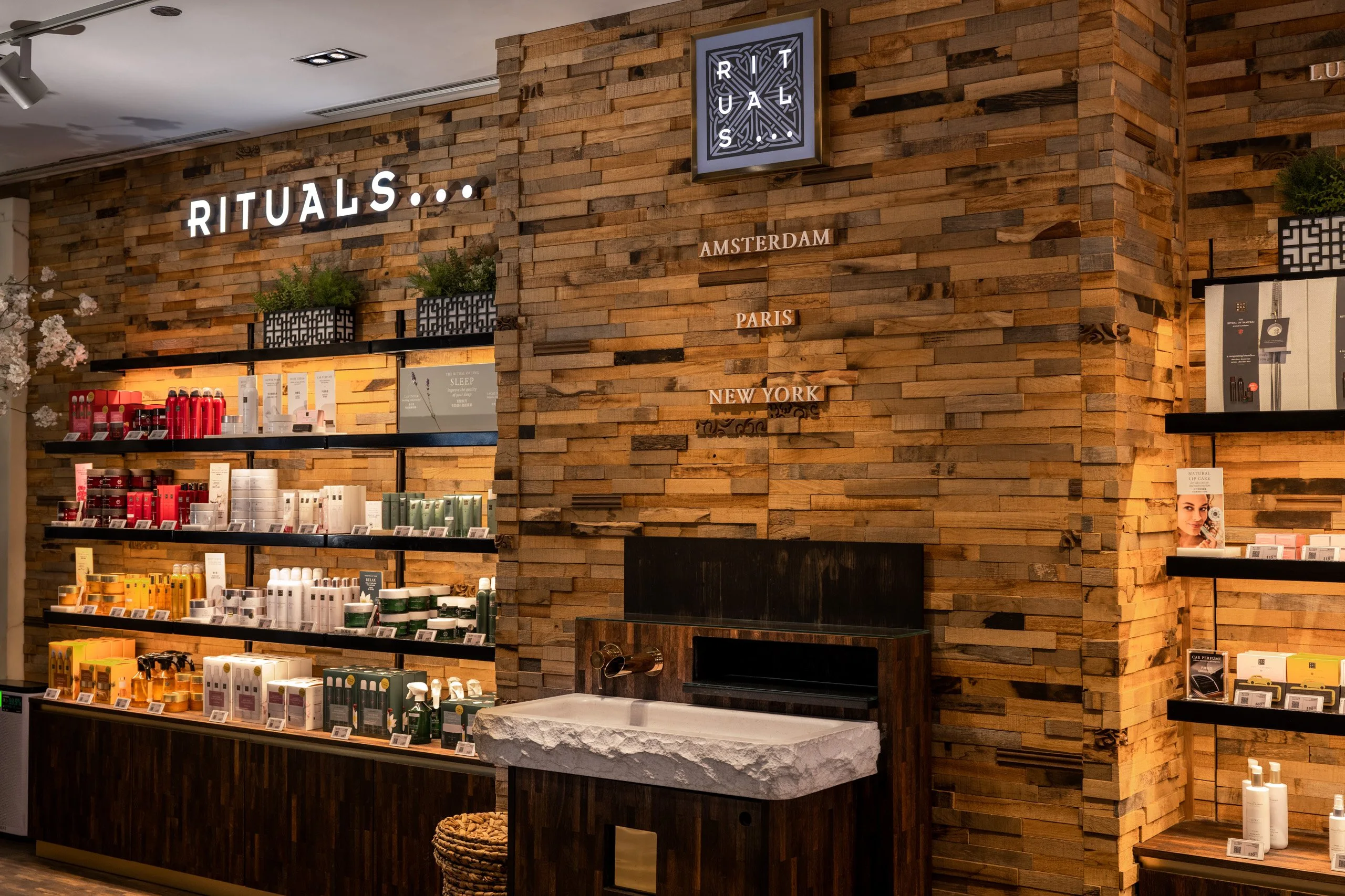 Rituals store interior with reclaimed-wood shelving — retail interior photography by Kenn Photographic Arts