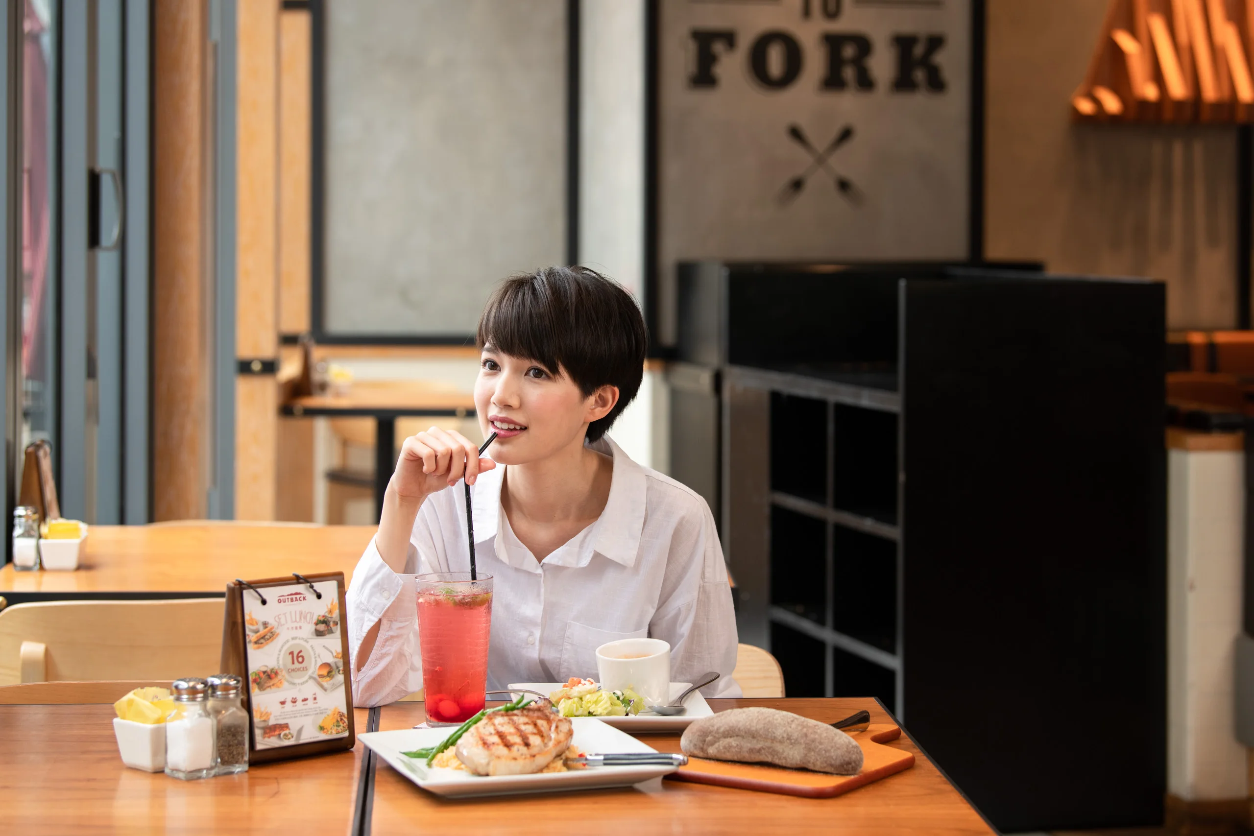 Woman enjoying lunch at Fork restaurant — restaurant commercial photography by Kenn Photographic Arts