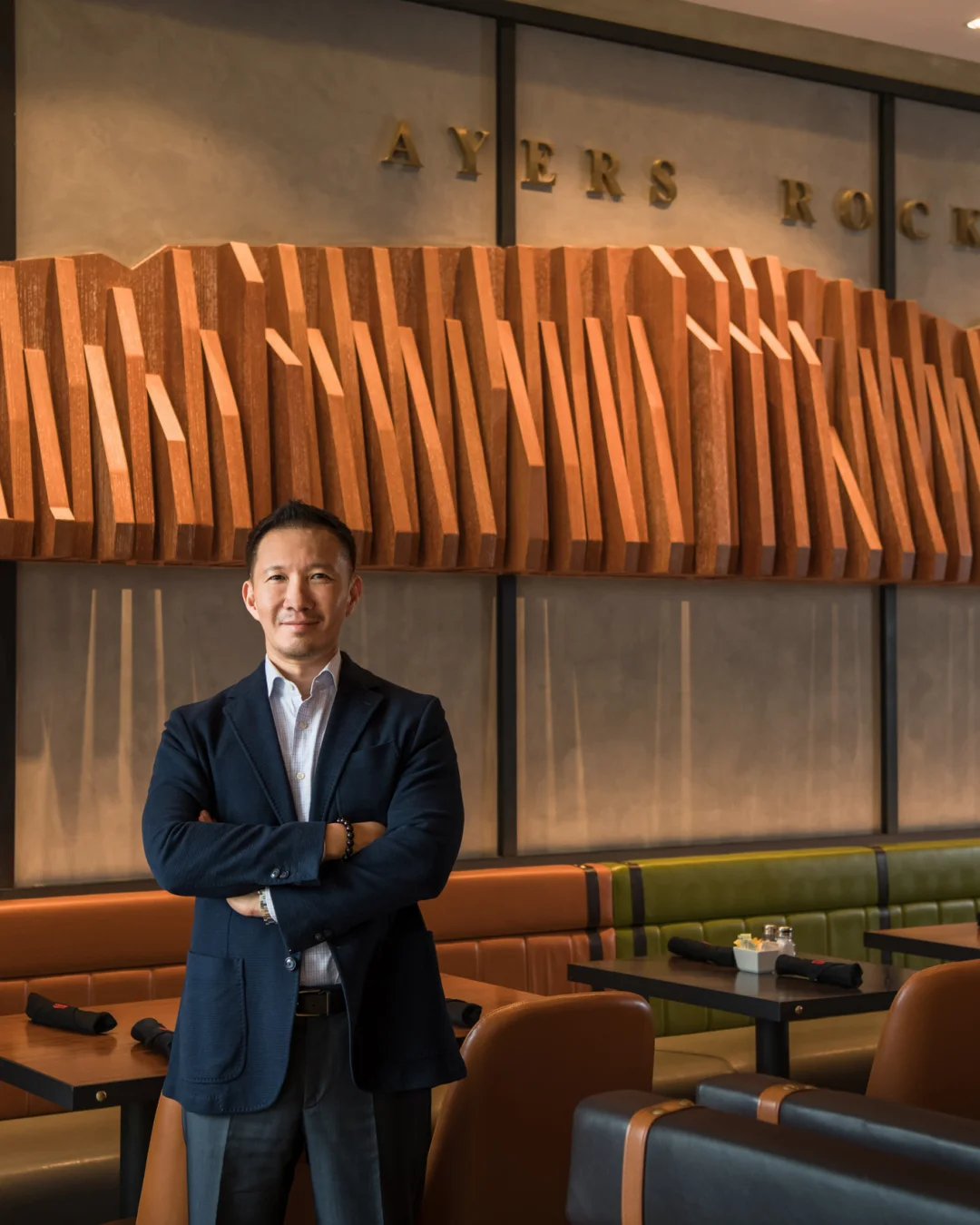 Executive portrait inside Ayers Rock restaurant — corporate portrait photography by Kenn Photographic Arts