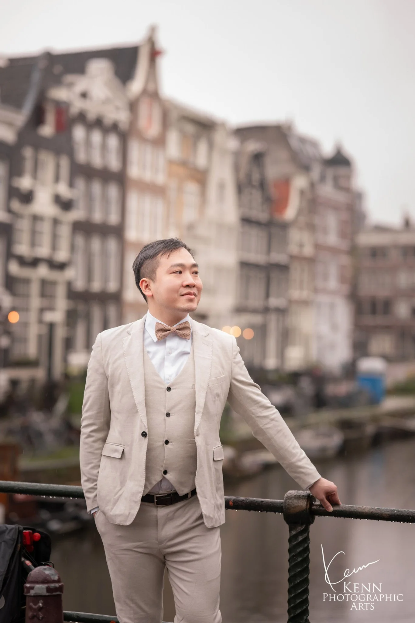 Portrait of Vincent at a canal railing in Amsterdam — Netherlands pre-wedding by Kenn Photographic Arts
