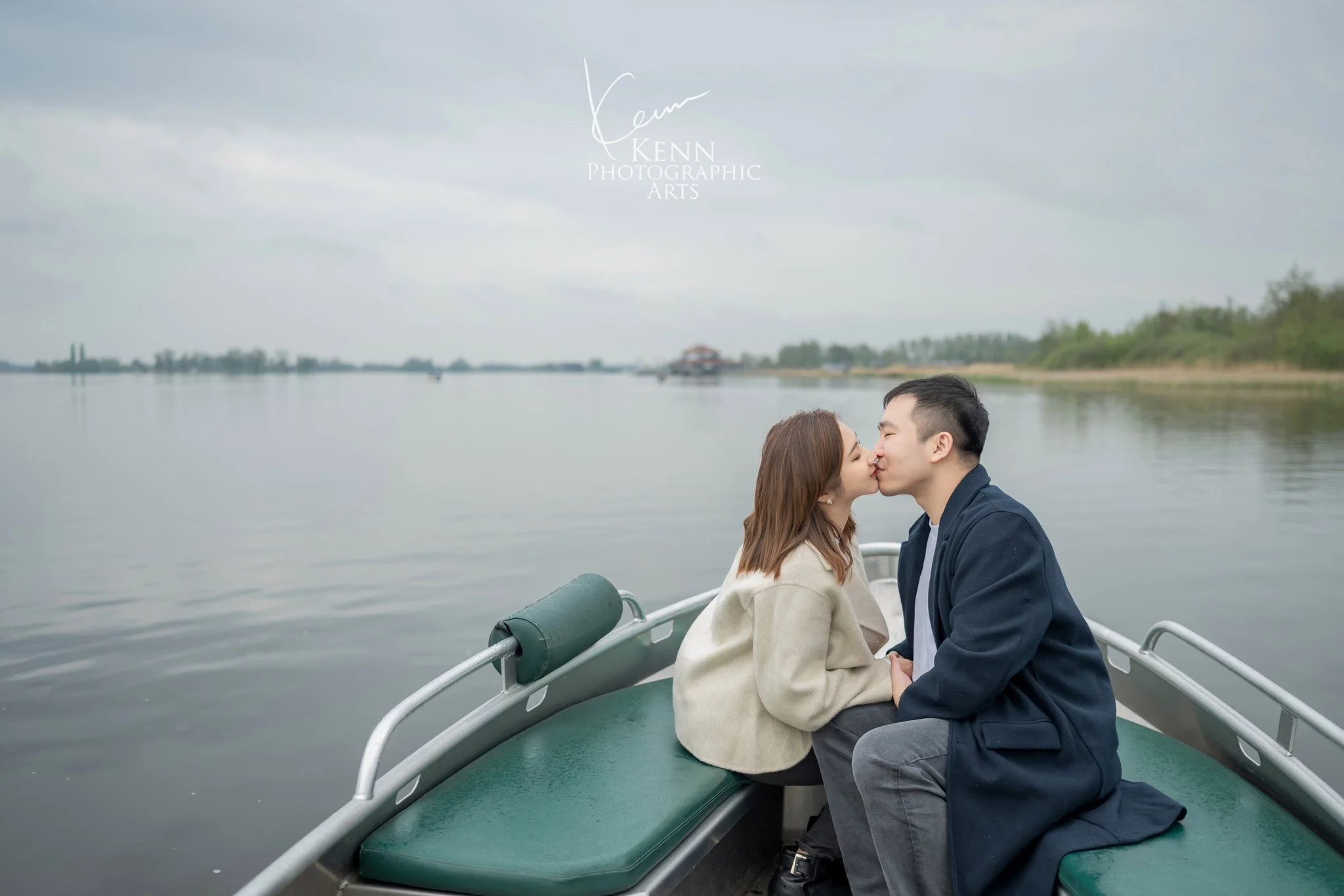 Michelle & Vincent sharing a kiss in a boat on the lake near Giethoorn — Netherlands pre-wedding by Kenn Photographic Arts