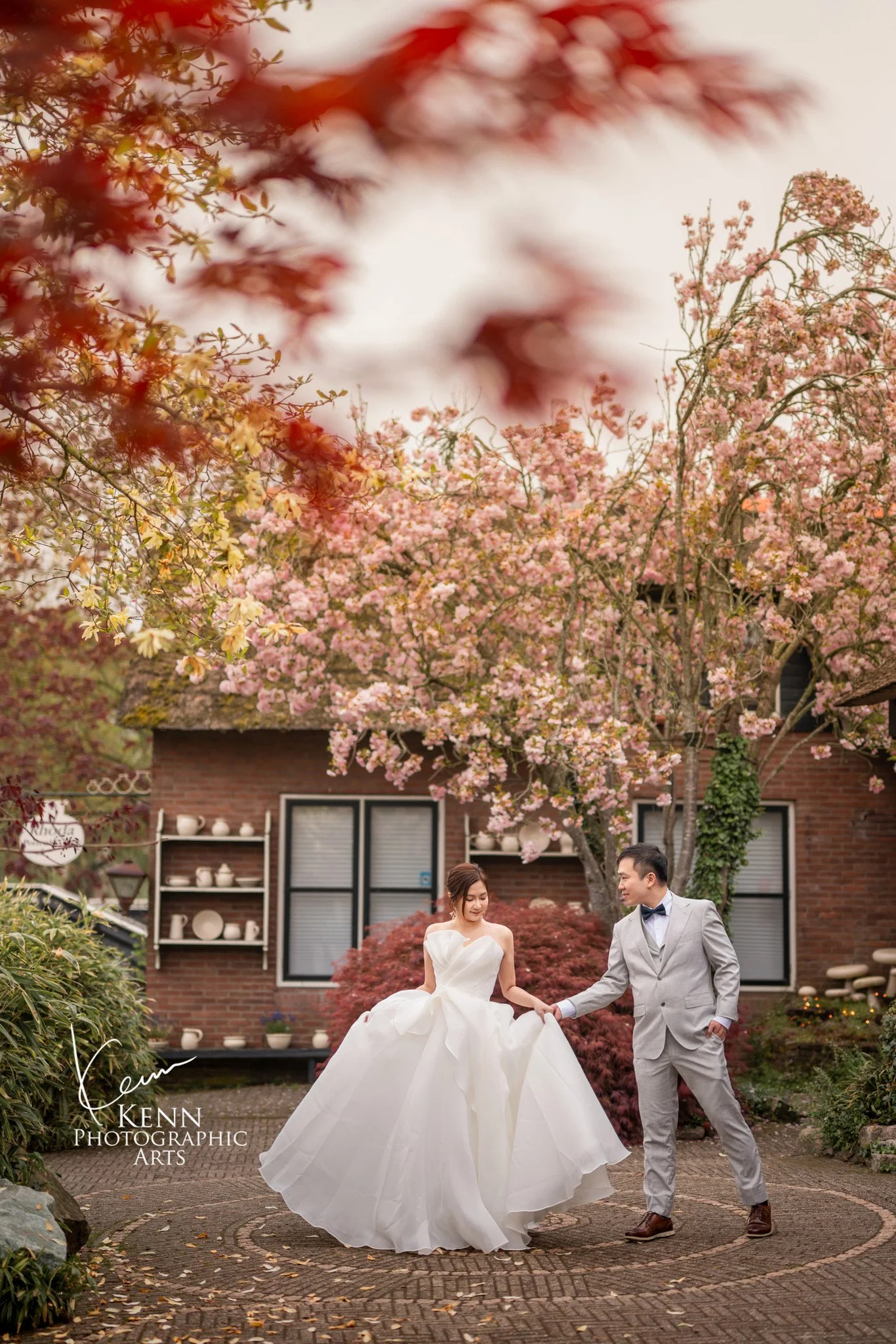 Michelle & Vincent dancing in a blossoming garden in Giethoorn — Netherlands pre-wedding by Kenn Photographic Arts