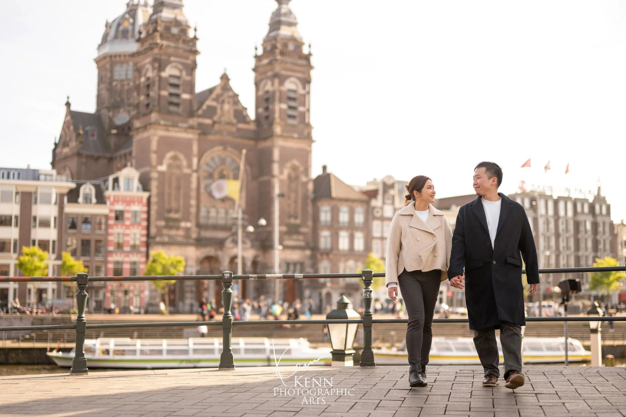 Michelle & Vincent walking beside the Basilica of St Nicholas, Amsterdam — Netherlands pre-wedding by Kenn Photographic Arts